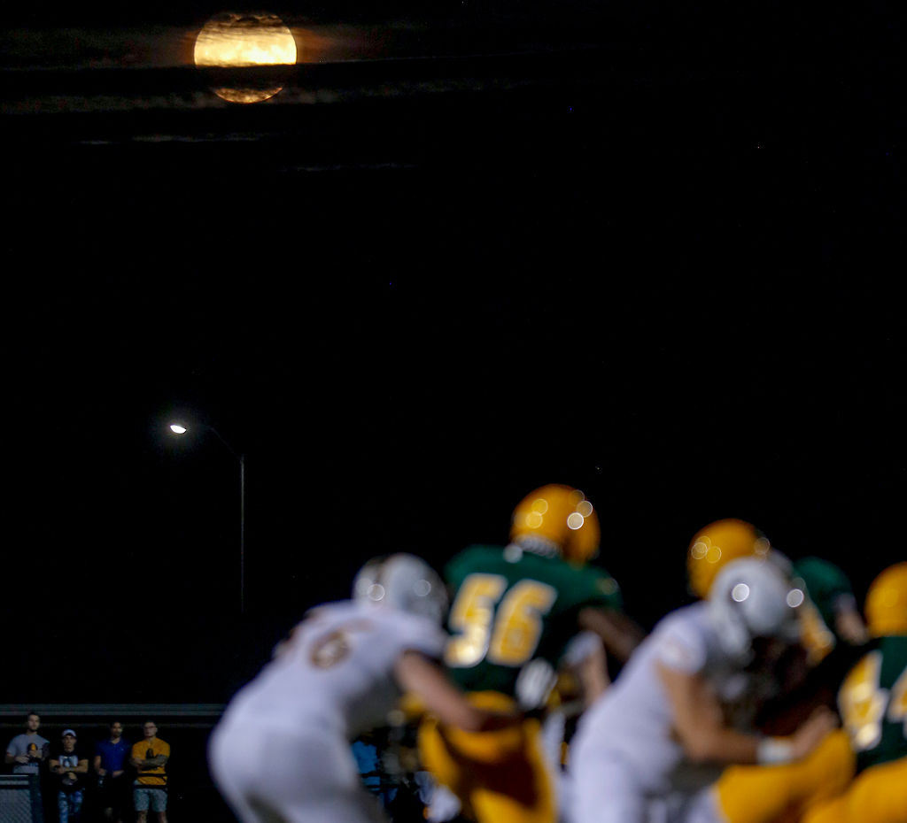 The full harvest moon rises above Rock Bridge